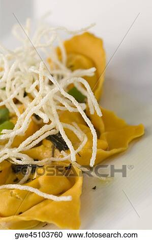Close-up of dumplings with noodles in a plate View Large Photo Image Stock Image - Close-up of dumplings with noodles in a plate. Fotosearch