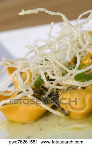 Close-up of dumplings with noodles in a plate View Large Photo Image Stock Image - Close-up of dumplings with noodles in a plate. Fotosearch