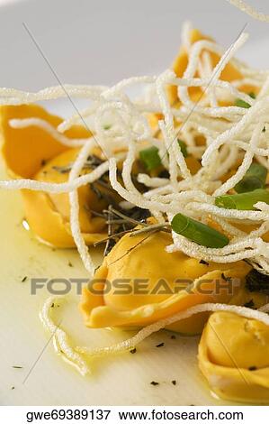 Close-up of dumplings with noodles in a plate View Large Photo Image Stock Photo - Close-up of dumplings with noodles in a plate. Fotosearch