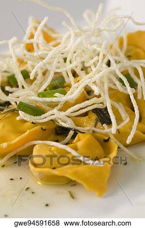 Close-up of dumplings with noodles in a plate View Large Photo Image Stock Photo - Close-up of dumplings with noodles in a plate. Fotosearch