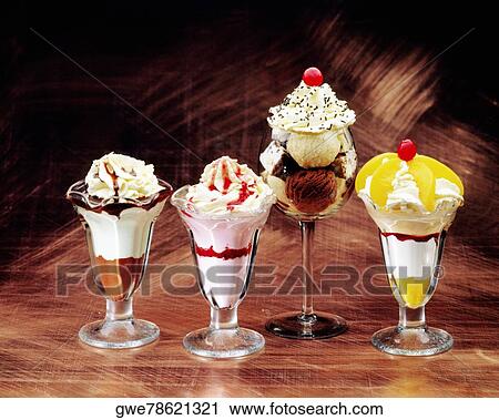 Stock Image - Close-up of glasses of ice-cream sundae. Fotosearch