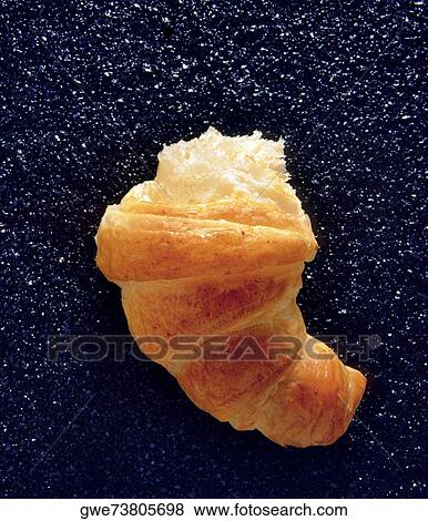 Close-up of half a croissant View Large Photo Image Stock Photo - Close-up of half a croissant. Fotosearch