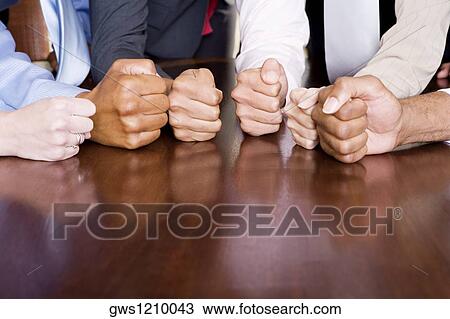 Close-up of human fists on the table View Large Photo Image Stock Image - Close-up of human fists on the table. Fotosearch