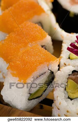 Stock Image - Close-up of maki sushi in a row. Fotosearch