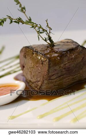 Close-up of meat loaf with a spoon full of gravy in a plate View Large Photo Image Stock Image - Close-up of meat loaf with a spoon full of gravy in a plate. Fotosearch