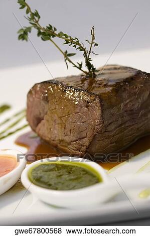Close-up of meat loaf with a spoon full of gravy in a plate View Large Photo Image Stock Photo - Close-up of meat loaf with a spoon full of gravy in a plate. Fotosearch