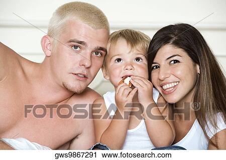 Close-up of parents with their son View Large Photo Image Stock Image - Close-up of parents with their son. Fotosearch