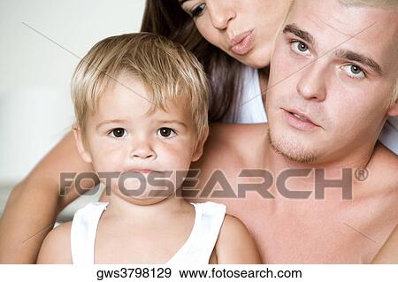 Close-up of parents with their son View Large Photo Image Stock Photo - Close-up of parents with their son. Fotosearch