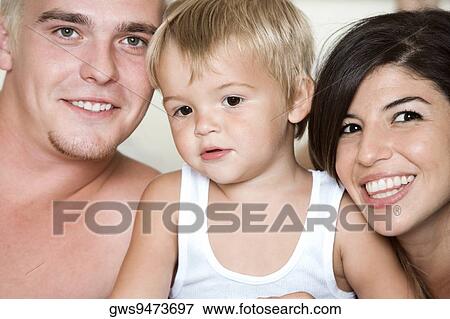 Close-up of parents with their son View Large Photo Image Stock Photo - Close-up of parents with their son. Fotosearch