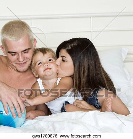 Close-up of parents with their son View Large Photo Image Stock Photograph - Close-up of parents with their son. Fotosearch