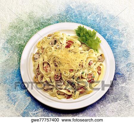 Close-up of pasta in a plate View Large Photo Image Stock Image - Close-up of pasta in a plate. Fotosearch