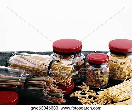 Stock Image - Close-up of pastas in containers. Fotosearch