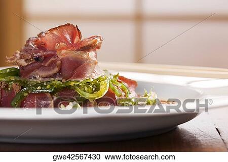 Close-up of prepared pork in a plate View Large Photo Image Stock Image - Close-up of prepared pork in a plate. Fotosearch