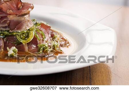 Close-up of prepared pork in a plate View Large Photo Image Stock Photo - Close-up of prepared pork in a plate. Fotosearch