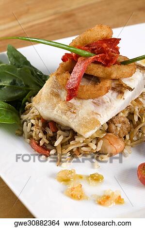 Close-up of rice and a fish fillet in a plate View Large Photo Image Picture - Close-up of rice and a fish fillet in a plate. Fotosearch