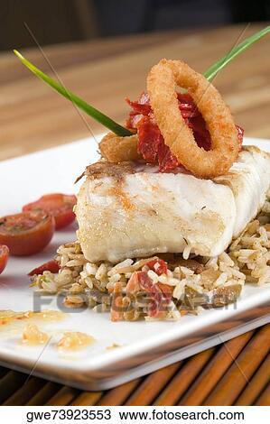 Close-up of rice and a fish fillet in a plate View Large Photo Image Stock Image - Close-up of rice and a fish fillet in a plate. Fotosearch