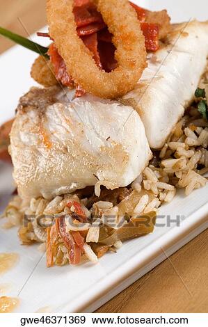 Close-up of rice and a fish fillet in a plate View Large Photo Image Stock Photo - Close-up of rice and a fish fillet in a plate. Fotosearch