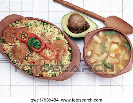 Picture - Close-up of rice served with roast chicken. Fotosearch