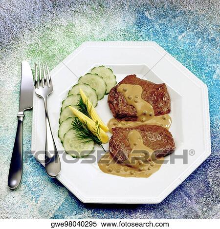 Close-up of roast beef served with sauce View Large Photo Image Stock Photography - Close-up of roast beef served with sauce. Fotosearch