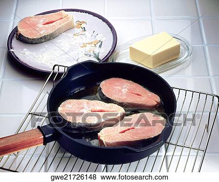 Close-up of salmon in a frying pan View Large Photo Image Stock Photo - Close-up of salmon in a frying pan. Fotosearch