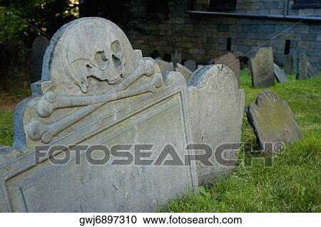 Stock Image - Close-up of skull and cross bones on a grave, Boston, Massachusetts, USA. Fotosearch