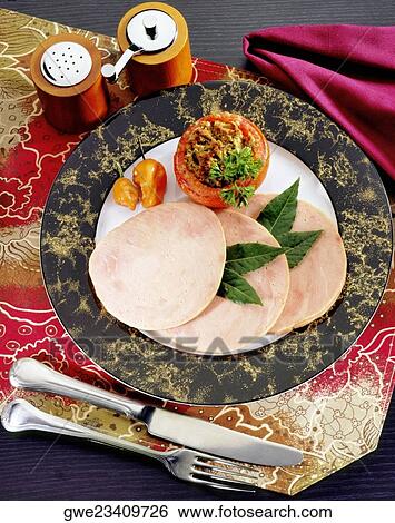 Close-up of sliced ham with a stuffed tomato View Large Photo Image Stock Photograph - Close-up of sliced ham with a stuffed tomato. Fotosearch
