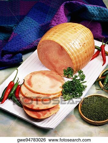 Stock Photograph - Close-up of sliced ham with salad. Fotosearch