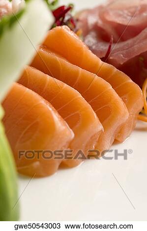 Stock Image - Close-up of slices of prepared fish. Fotosearch