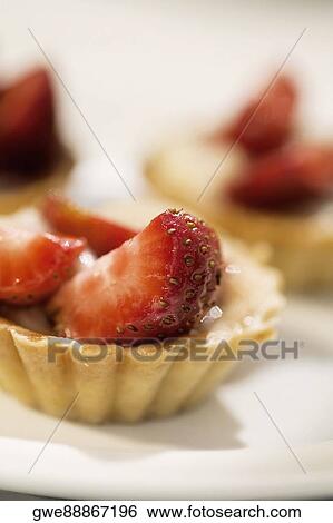 Close-up of strawberry tarts View Large Photo Image Stock Photograph - Close-up of strawberry tarts. Fotosearch