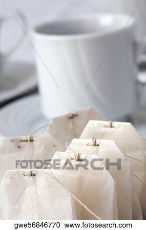 Close-up of teabags beside a cup View Large Photo Image Stock Image - Close-up of teabags beside a cup. Fotosearch