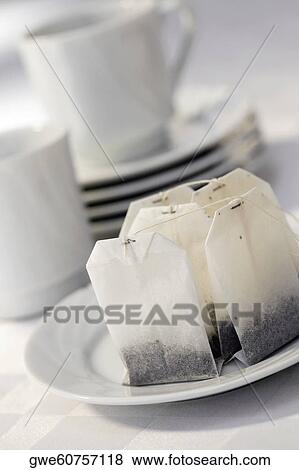 Close-up of teabags in a plate View Large Photo Image Stock Photo - Close-up of teabags in a plate. Fotosearch