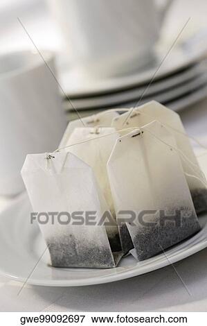 Close-up of teabags in a plate View Large Photo Image Stock Photo - Close-up of teabags in a plate. Fotosearch