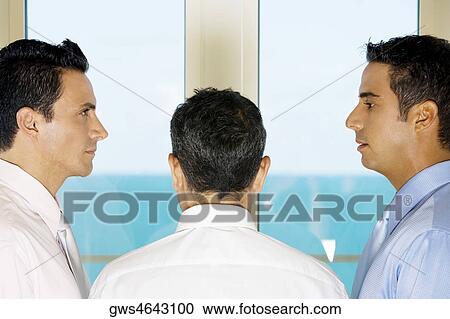 Stock Image - Close-up of three businessmen. Fotosearch