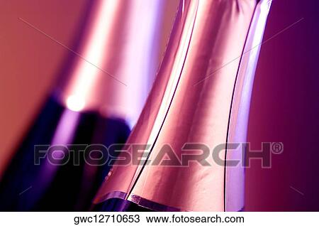 Close-up of two champagne bottles View Large Photo Image Stock Image - Close-up of two champagne bottles. Fotosearch