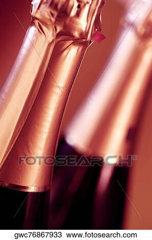 Close-up of two champagne bottles View Large Photo Image Stock Image - Close-up of two champagne bottles. Fotosearch