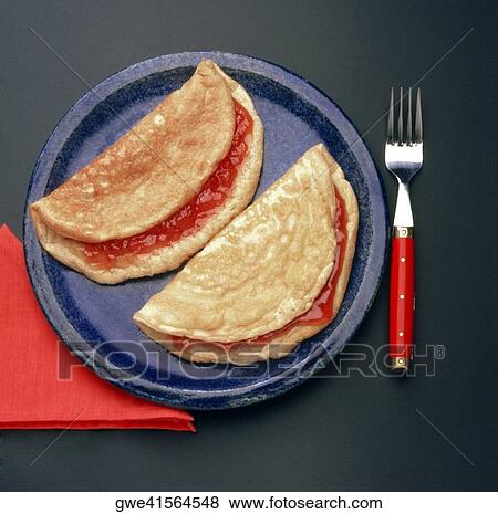 Close-up of two omelets with jam View Large Photo Image Stock Photo - Close-up of two omelets with jam. Fotosearch