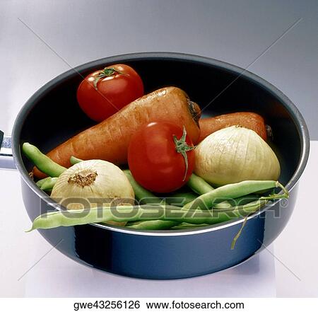 Close-up of vegetables in a frying pan View Large Photo Image Stock Photograph - Close-up of vegetables in a frying pan. Fotosearch