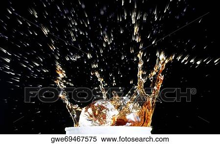 Close-up of water splashing out of a glass View Large Photo Image Stock Photography - Close-up of water splashing out of a glass. Fotosearch