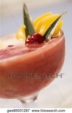 Stock Photo - Close-up of watermelon juice in a stem glass. Fotosearch