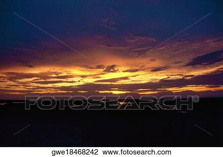 Stock Image - Cloud in the sky during sunset. Fotosearch