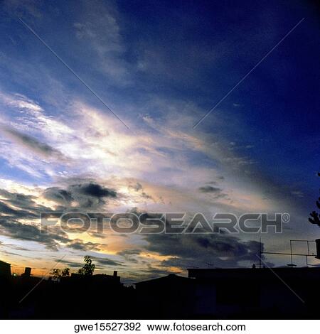 Clouds in the sky at dusk View Large Photo Image Stock Image - Clouds in the sky at dusk. Fotosearch