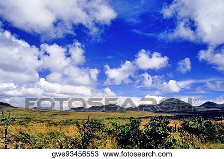 Stock Image - Clouds over a landscape. Fotosearch