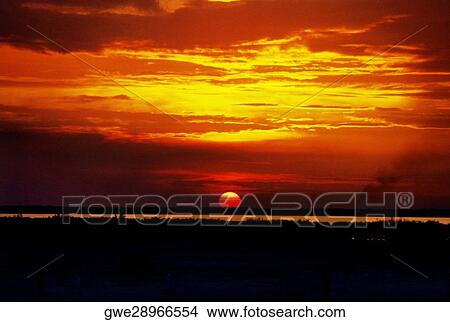 Clouds over the sea at sunset View Large Photo Image Picture - Clouds over the sea at sunset. Fotosearch