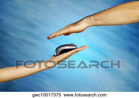 Stock Photography - Computer mouse on a woman's hand with a man's hand above it. Fotosearch