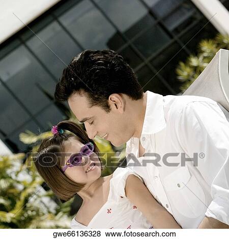 Stock Photo - Father sitting with his daughter. Fotosearch