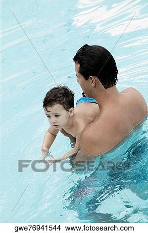 Picture - Father teaching his son how to swim. Fotosearch