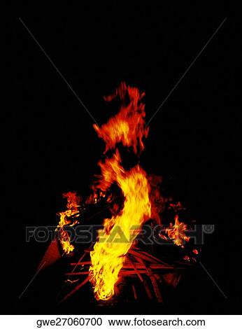 Flames of a fire at night View Large Photo Image Stock Image - Flames of a fire at night. Fotosearch