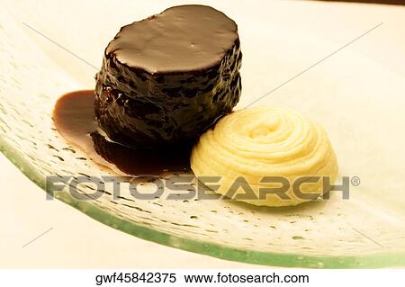 High angle view of a chocolate dessert served with a cookie View Large Photo Image Stock Photography - High angle view of a chocolate dessert served with a cookie. Fotosearch