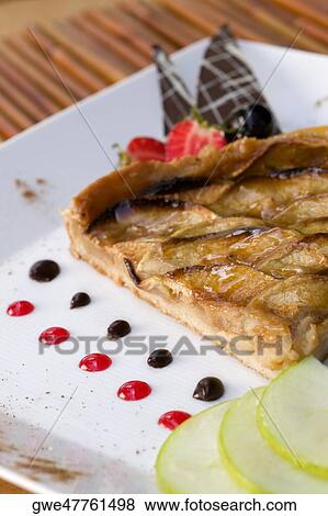 High angle view of a pie in a plate View Large Photo Image Stock Photo - High angle view of a pie in a plate. Fotosearch
