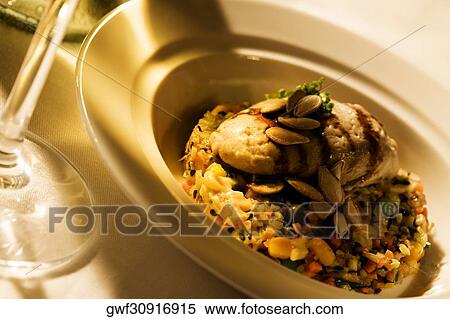High angle view of a plate of grilled meat on beans View Large Photo Image Stock Photography - High angle view of a plate of grilled meat on beans. Fotosearch